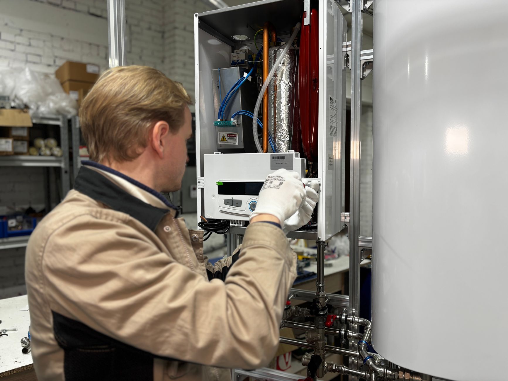 Technician installing a new residential water heater